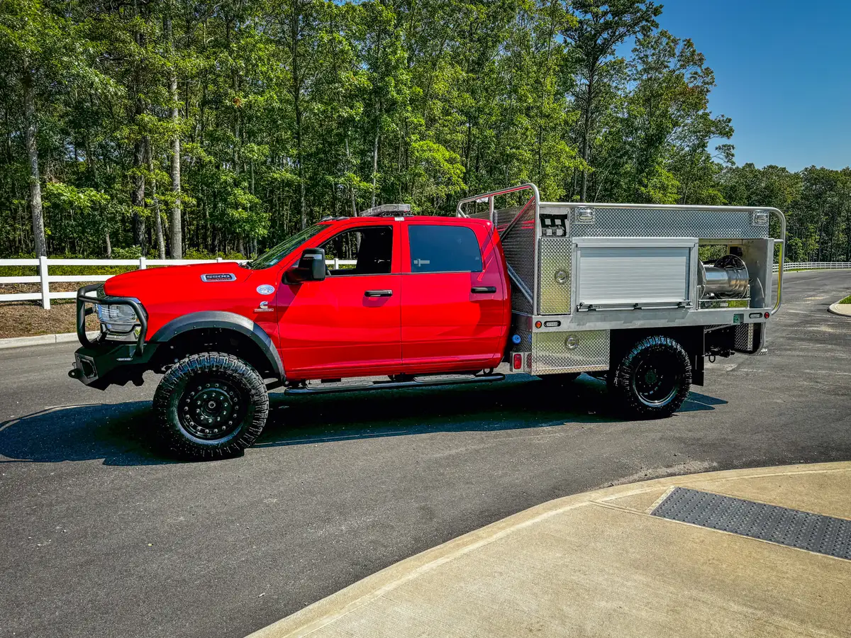 Rear-left three-quarter view with rear platform and open compartment area.